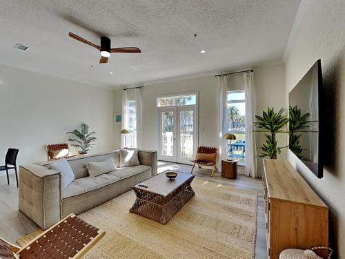 a living room with a couch and a table at Gulf Place Spires #7B - Rum Cake in Santa Rosa Beach