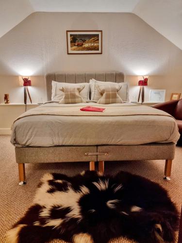 a bedroom with a bed with a dog laying on the floor at Doric House in Inverness