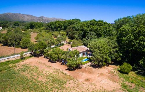 an aerial view of a house with trees and a pool at Na Mikeleta in Capdepera