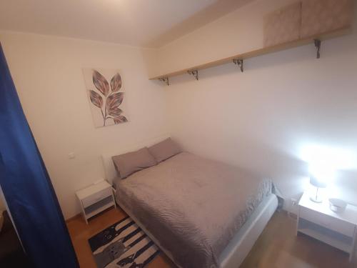 a small bedroom with a bed in a room at Jõekalda kodu in Pärnu