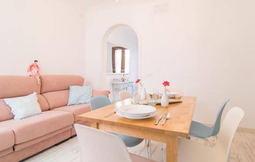 a living room with a table and a couch at Convent in Alcudia