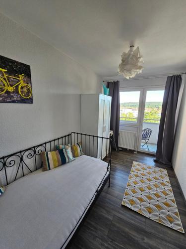 a bedroom with a bed with a bike on the wall at Deluxapartment in Kaiserslautern
