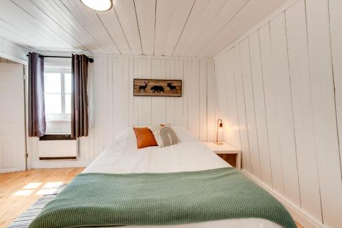 a bedroom with a large bed in a room at Le Toit Rouge - 3457 in Saint-Férréol-les-Neiges