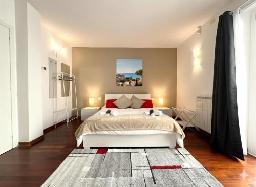 a bedroom with a large bed with red pillows at Residence Il Boschetto - Villa Con Piscina in Grosseto