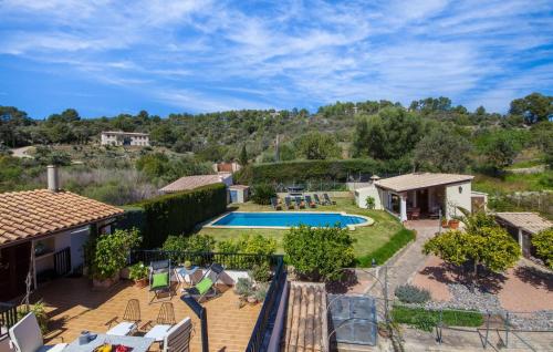 an aerial view of a house with a swimming pool at Ca Na Rosa De Selva in El Port de la Selva