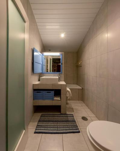 a bathroom with a sink and a mirror at Bairro do Casal - Turismo d'Aldeia in Vila Nova de Foz Coa