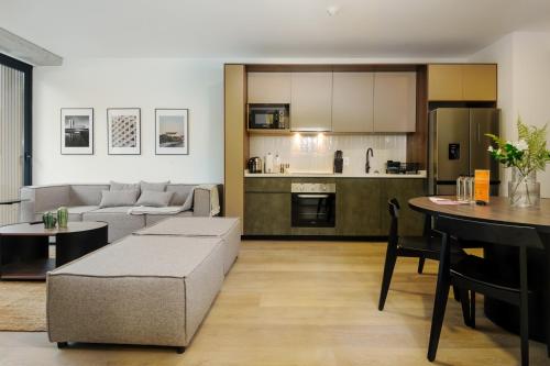 a living room with a couch and a table at Sullivan by Wynwood House in Mexico City
