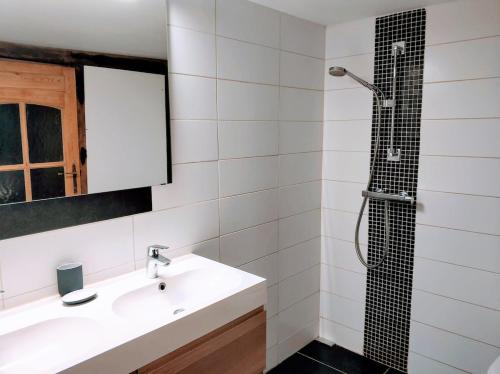 a bathroom with a sink and a shower at Au coeur de l'Ardenne - Peaceful loft in Baelen