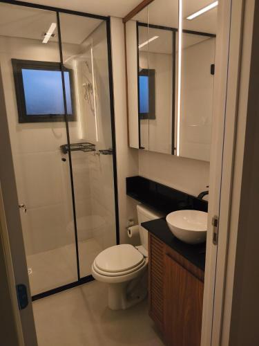 a bathroom with a shower and a toilet and a sink at Premium Apartment in Bagé in Bagé