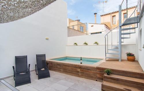 a swimming pool on the side of a building at Petit Arta - Sa Botigueta in Artá