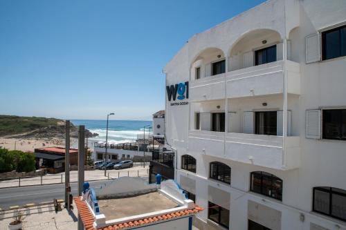 a view of the beach from the balcony of a hotel at WOT Ocean Soul in Sintra