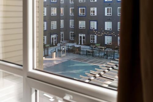 a view of a tennis court from a window at Hyatus Luxury Residences Boston Everett Signature Collection in Everett