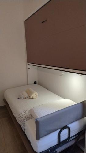a bedroom with a bed with a large screen above it at B&B Zvana's - Da Giovanna in Imola