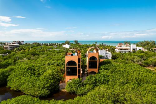 an aerial view of a building in the middle of a river at Coco Lou - Private Villa with Rooftop Pool in Holbox Island