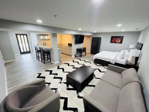 a large living room with a bed and a couch at The Resort at Lake of the Ozarks in Lake Ozark