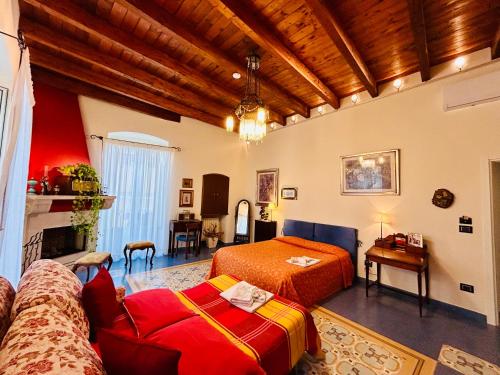a living room with a bed and a couch at VinsLounge Suite in Barletta