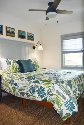 a bedroom with a bed and a ceiling fan at 427 Broad Street in Georgetown