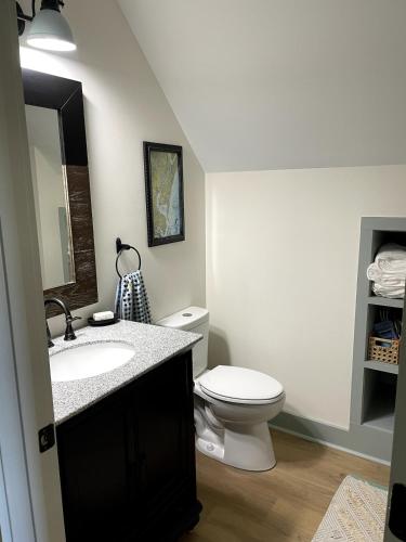 a bathroom with a white toilet and a sink at 427 Broad Street in Georgetown