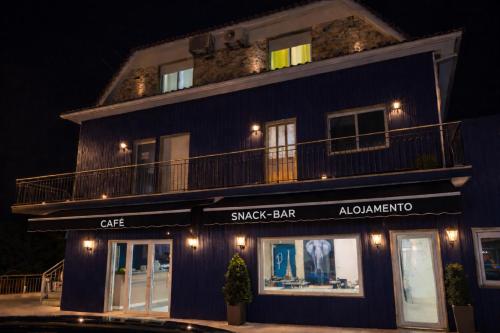 a night view of a music bar with a building at Paris By Palacium Group in Figueiró dos Vinhos