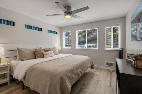 a bedroom with a bed and a ceiling fan at Base Camp for all of Sandpoint and Lake Pend Oreille Adventures in Sandpoint