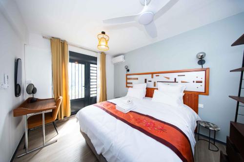 Kama o mga kama sa kuwarto sa Guyane Appart'Hôtel