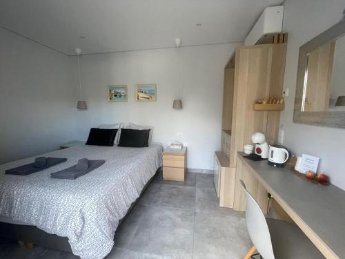 a bedroom with a large bed and a counter at SalemaView Ensuite bedroom in Salema