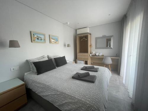 a bedroom with a bed with two towels on it at SalemaView Ensuite bedroom in Salema