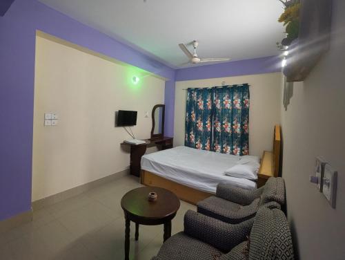 En eller flere senge i et værelse på Cox Flat Booking