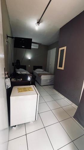 a room with a room with a room with a room at Hotel Colonial Bragança Paulista in Bragança Paulista