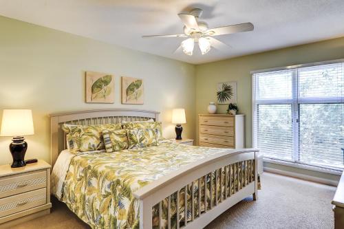a bedroom with a bed and a ceiling fan at Anchorage 7442 in Hilton Head Island