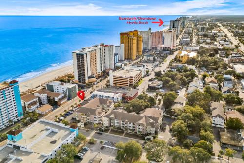 an aerial view of the beach in front of the ocean at Chelsea House unit 201 in Myrtle Beach