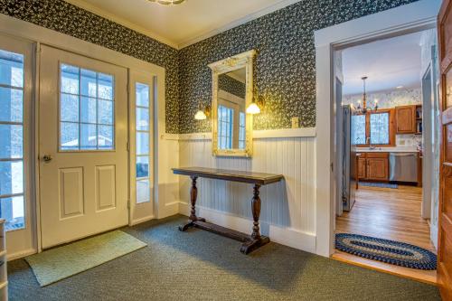 a home office with a table and a mirror at The Greenfield in Bethlehem