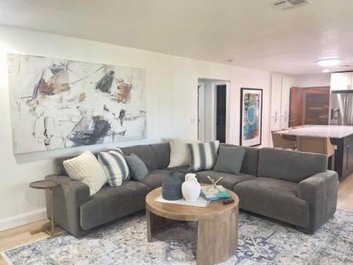 a living room with a couch and a table at Brush Hill Lakehouse in Checotah