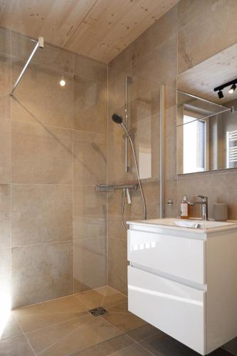 a bathroom with a shower and a sink at Haus Gerti in Ramsau am Dachstein