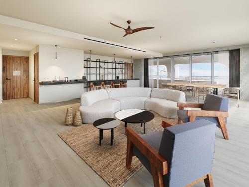 a living room with a couch and a table at Hyatt Vivid Grand Island Cancun-All Inclusive Adults Only in Cancún