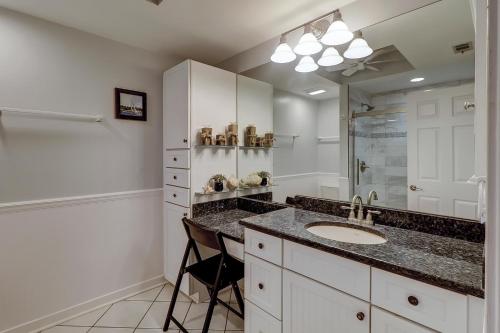 a bathroom with a sink and a mirror at Beachside Tennis 1869 in Hilton Head Island