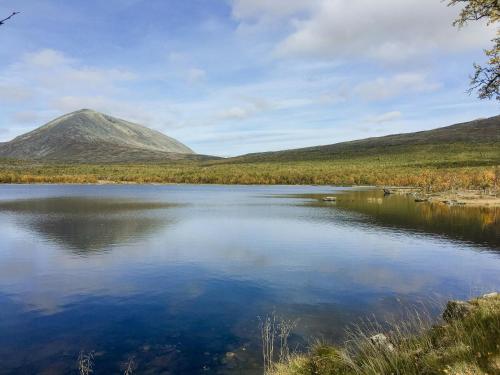 a view of a lake with a mountain in the background at Simple Mountain Cabin Near Vinstra in Vinstra