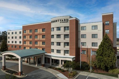a rendering of the front of a hotel at Courtyard Greensboro Airport in Greensboro