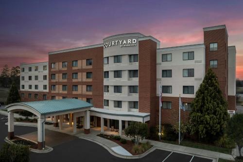 a rendering of the front of a hotel at Courtyard Greensboro Airport in Greensboro