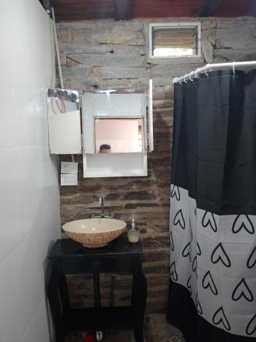 a bathroom with a sink and a mirror at Espacio de relax in Trapiche