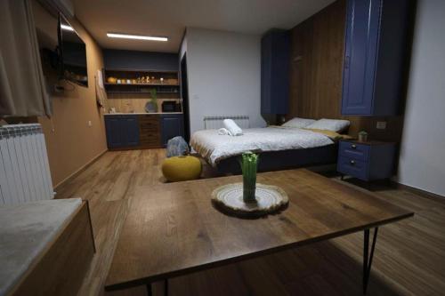 a bedroom with a bed and a table in a room at להנות מהטבע שמס in Majdal Shams