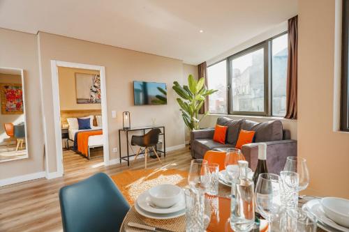 a living room with a table and a couch at CONDE13 Aparthotel Boutique in Lisbon