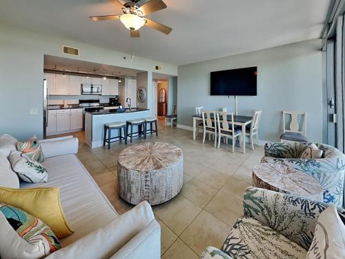 a living room with two couches and a kitchen at Palisade Palms TW1012 - Sea Escape in Galveston