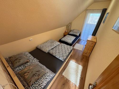 a room with two bunk beds in a house at Bíbic Vendégház in Kaposvár