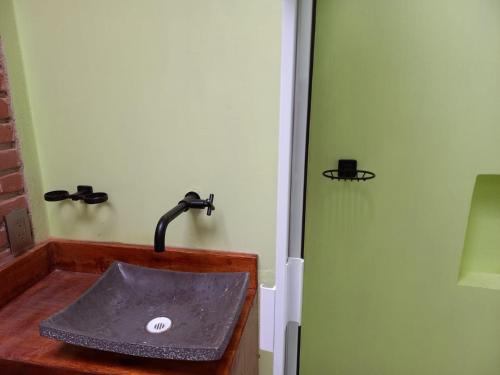 a bathroom with a sink in a room at Cabanas Madre Tierra Zacatlan in Cedro