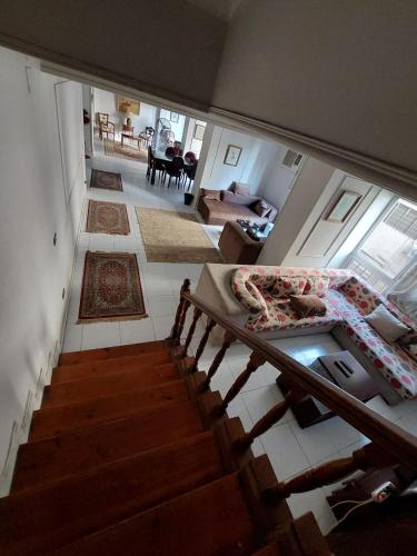 an overhead view of a living room and a staircase at Cozy Queen bed room in zamalek with garden view and balcony in Cairo