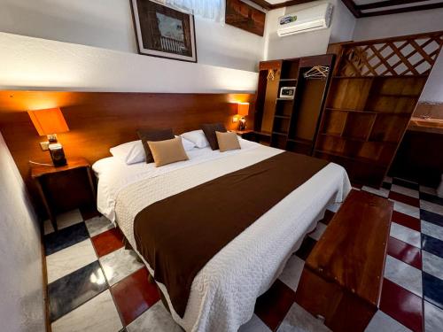 a bedroom with a large bed in a room at Maytenus Galapagos in Puerto Ayora