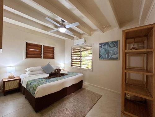 a bedroom with a bed and a ceiling fan at Erakor Island Resort & Spa in Port Vila