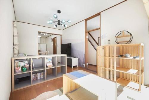 a living room with a couch and a table at Shinjuku area house with 3BR 2mins to Metro on foot in Tokyo