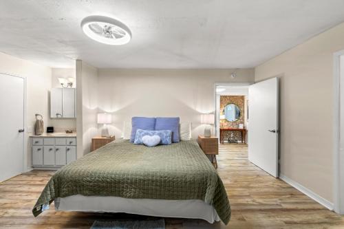 a bedroom with a large bed with blue pillows at Pigeon Forge Home in Pigeon Forge